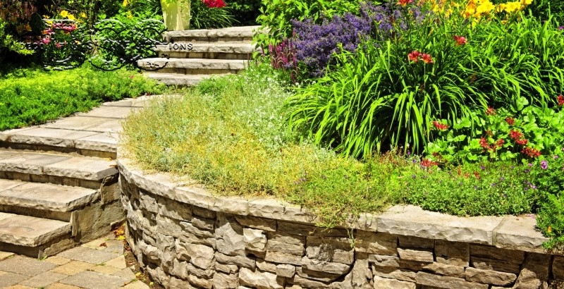 What are some common applications of decorative stone in landscape design?